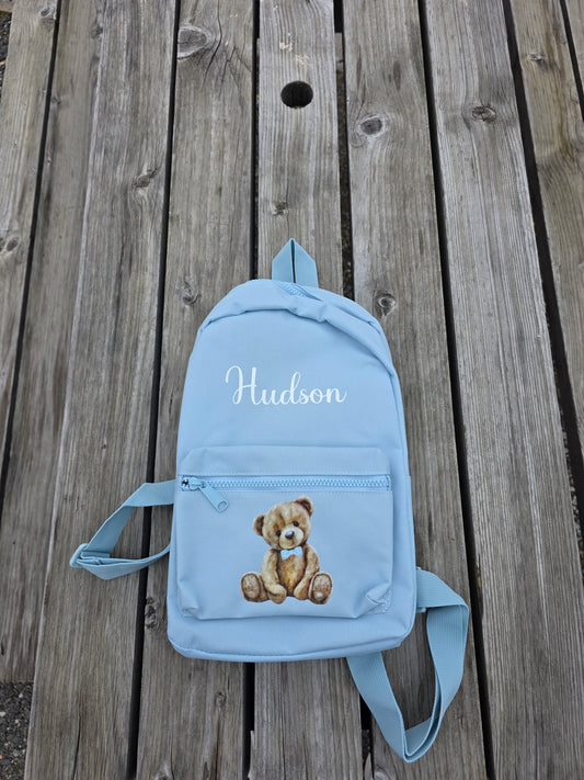Personalised blue kids backpack with custom name and teddy bear design for girls nursery or preschool bag